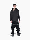 Model wearing a black VAIN shell jacket with asymmetrical waterproof zippers, heart-shaped yoke, and adjustable hood.