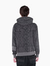 Back view of a model wearing a VAIN Skin Hoodie in grey snake print French terry cotton with a signature back yoke.