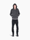 Model wearing a VAIN Skin Hoodie in grey snake-print French terry cotton with a front zipper and rib sleeve detail.